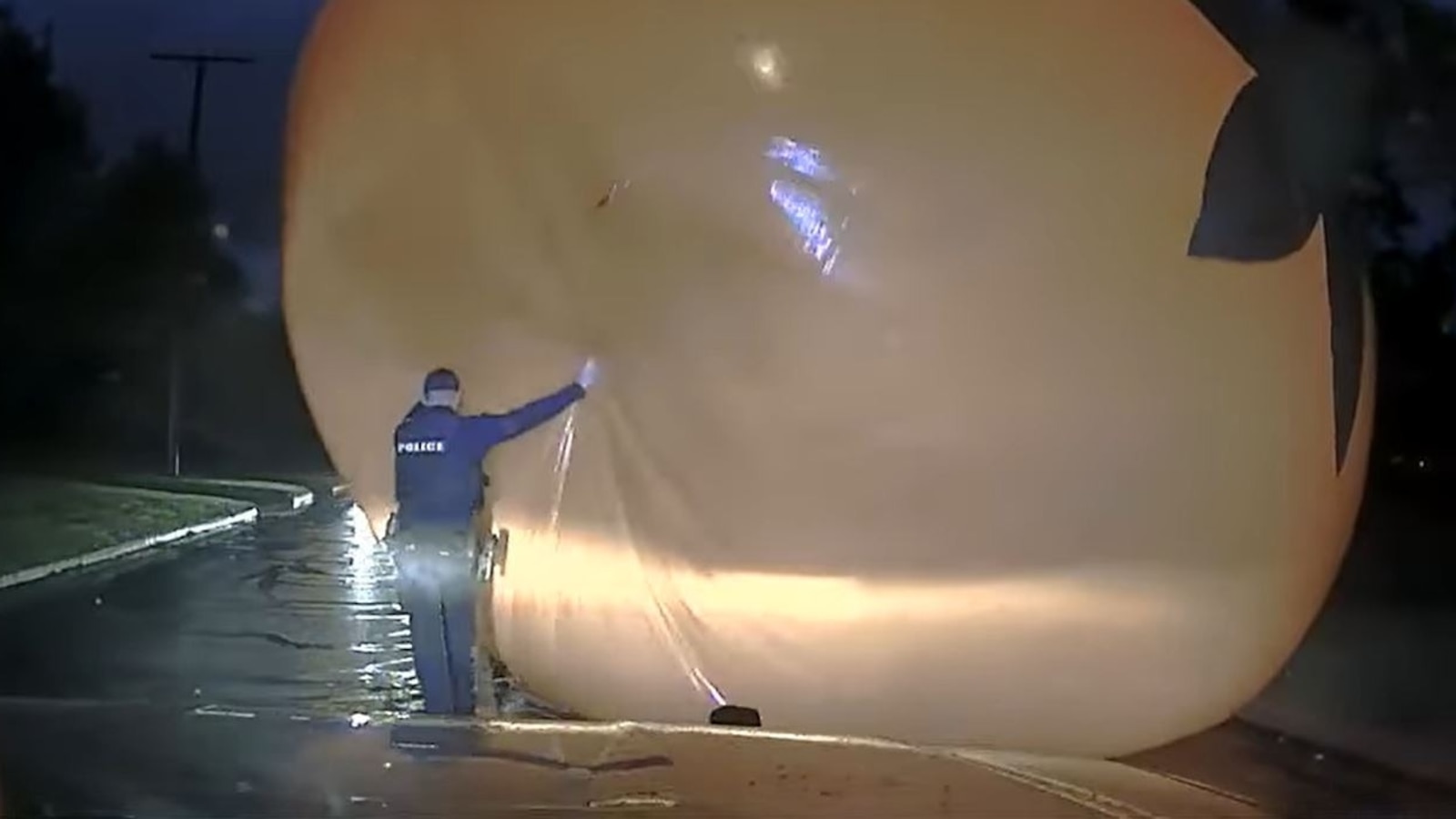 Cop 'attacked' by giant inflatable runaway Halloween pumpkin in middle of the street