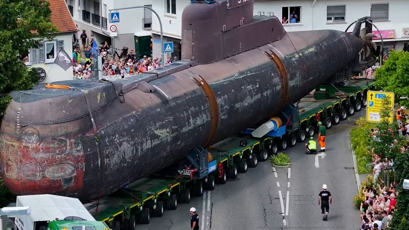 German submarine sets sail on long voyage to her final destination - by road