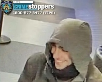 Image of suspect wanted by NYC police with a "tips" phone number