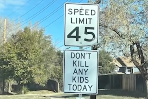 Person put up signs tell people not to kill people with cars. Police say that's criminal tampering.