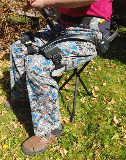 Seated person wearing a Hypershell X exoskeleton