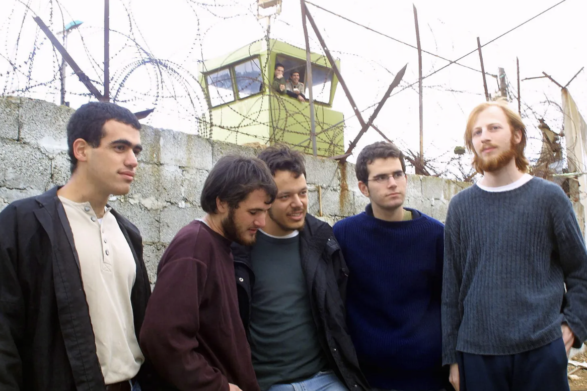 RSN Chairman of the Board Shimri Zameret, second from right, stands among fellow draft refusers amidst the Second Intifada, 2003.